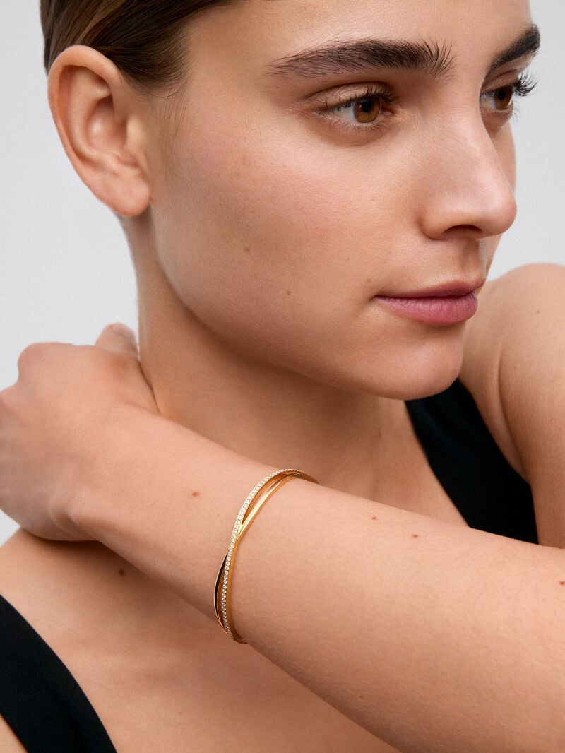Rigid yellow gold bracelet of 18k with white diamonds in 0.74 cts image number 1