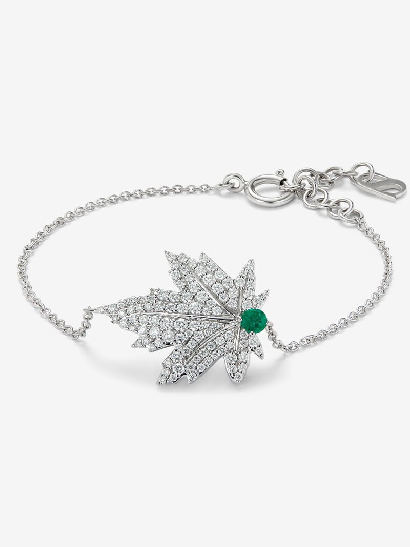 18K white gold bracelet with a 0.1 ct central emerald, diamond pavé, and a maple leaf design image number 0