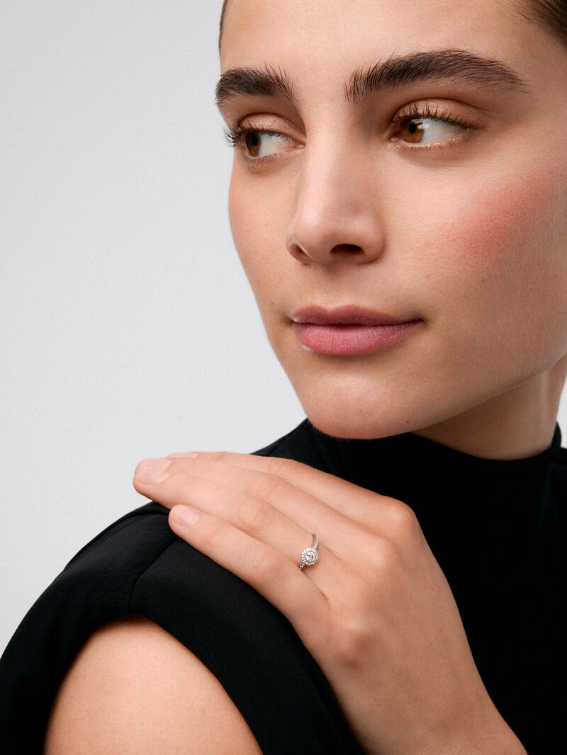 18K white gold solitaire engagement ring with a diamond halo image number 1