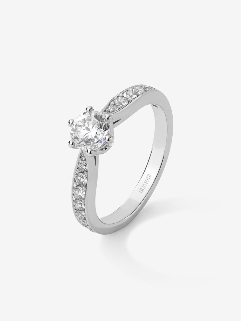 Solitaire ring in 18K white gold with a central 0.70-carat brilliant-cut diamond and additional diamonds totaling 0.31 cts image number 0