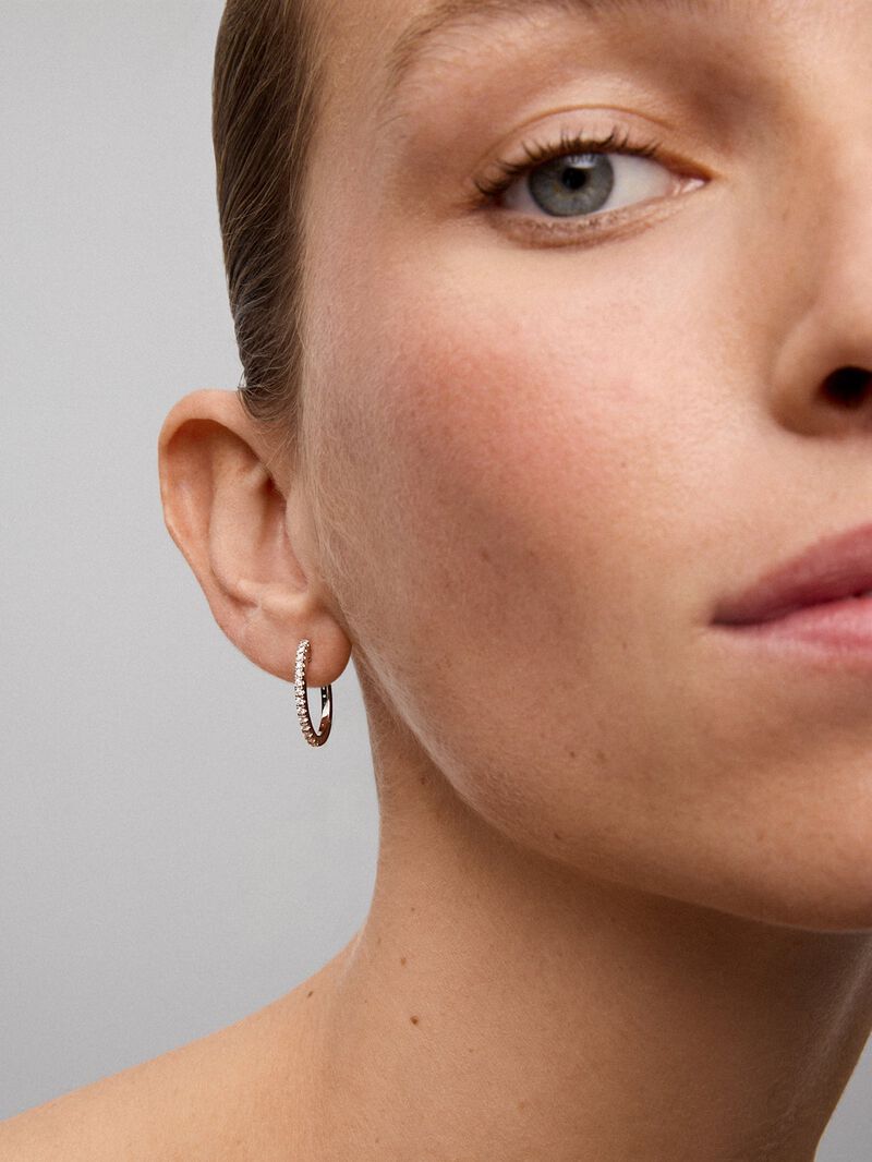 Thin hoop earrings made of 18K white gold with diamonds image number 3