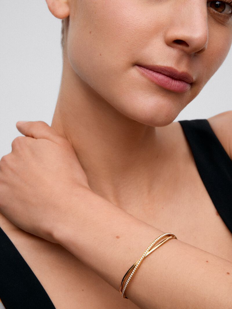 Rigid yellow gold bracelet of 18k with white diamonds in 0.74 cts image number 4