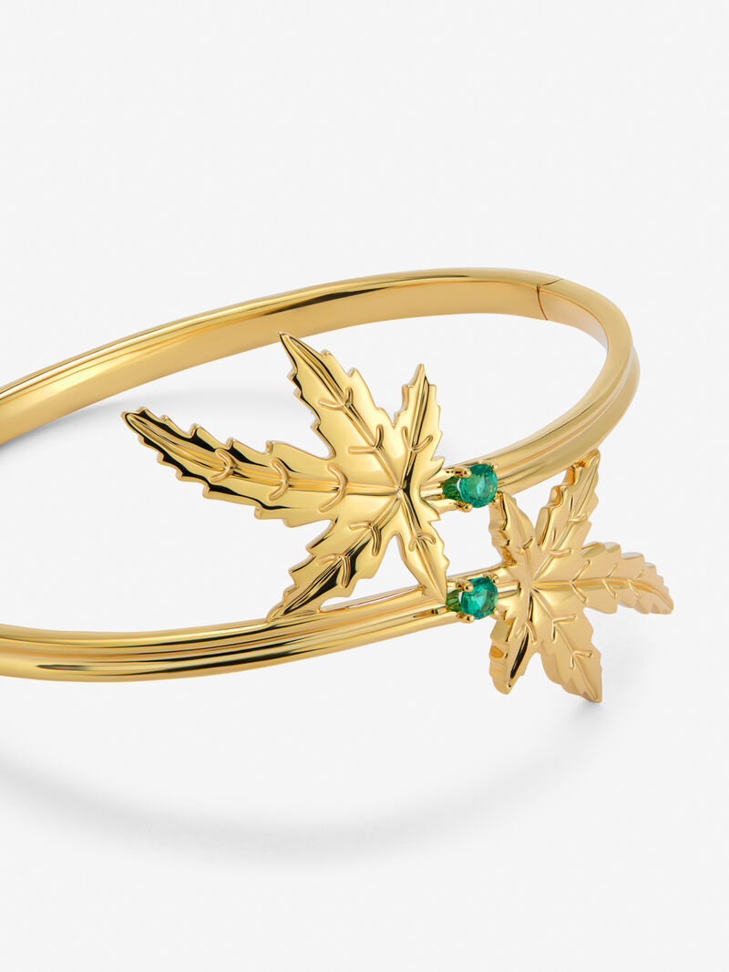 18K yellow gold bracelet with two brilliant-cut emeralds totaling 0.23 cts, in a maple leaf design. image number 1