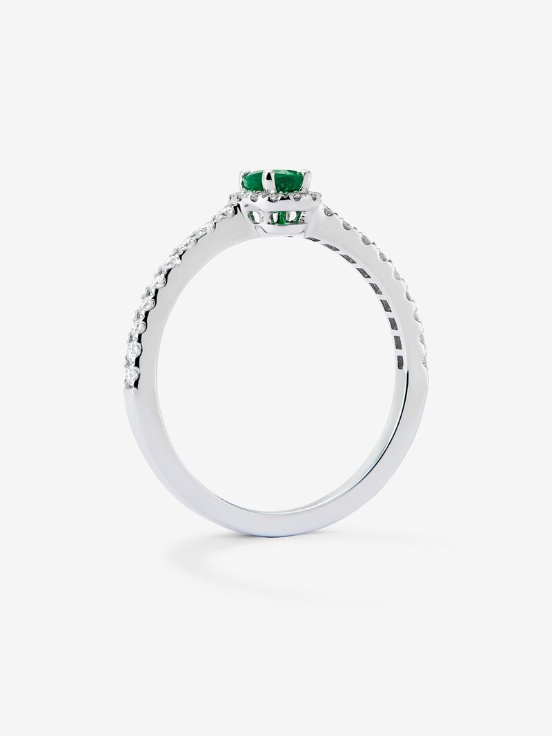18K white gold ring with a 0.25 ct oval-cut green emerald and brilliant-cut diamond border totaling 0.25 cts image number 4