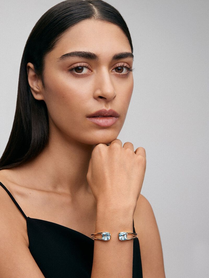 Rigid 18K yellow gold bracelet with 2 sky blue topazes in cushion cut with a total of 0.12 cts image number 2