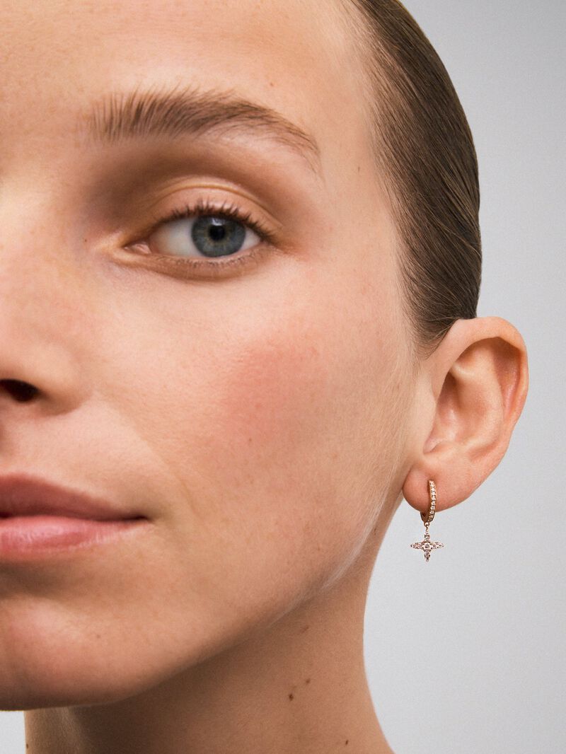 Individual hoop earring with hanging star in 18K rose gold with diamonds. image number 5