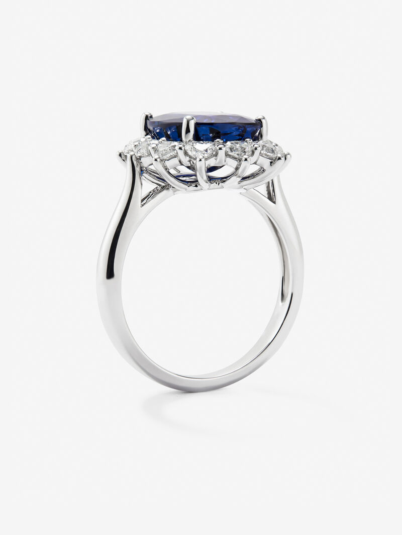 18K white gold ring with vivid blue sapphire in oval cut of 5.01 cts and 10 heart-cut diamonds with a total of 1.06 cts image number 4