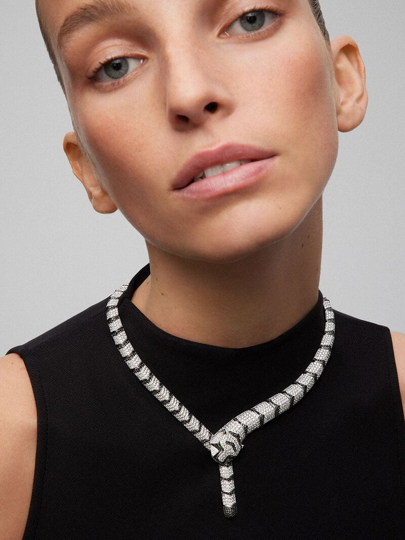Rigid 18K white gold necklace with 1325 brilliant-cut white diamonds with a total of 19.09 cts, 453 brilliant-cut black diamonds with a total of 3.61 cts, and 2 trapezoid-cut emeralds with a total of 0. 13 cts in the shape of a tiger image number 0