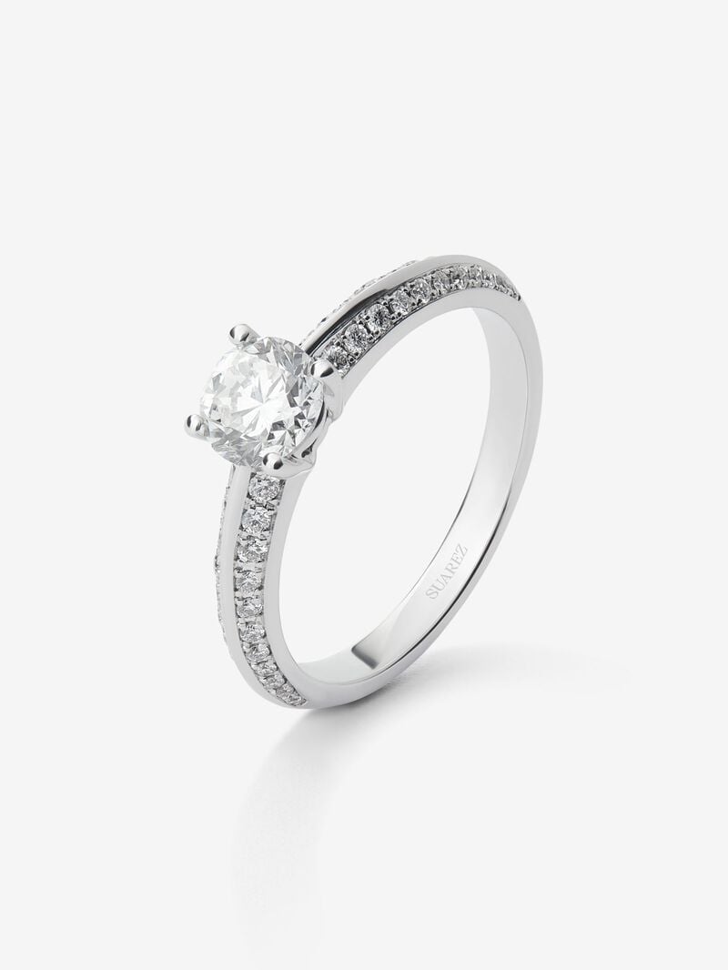 Solitaire ring in 18K white gold with a 0.70-carat central diamond and additional brilliant-cut diamonds totaling 0.25 cts image number 0