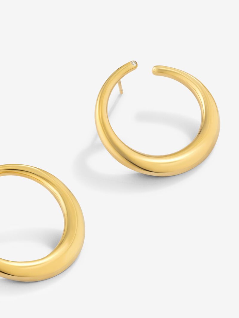 Large smooth hoop earrings in 18K yellow gold with diamond. image number 2