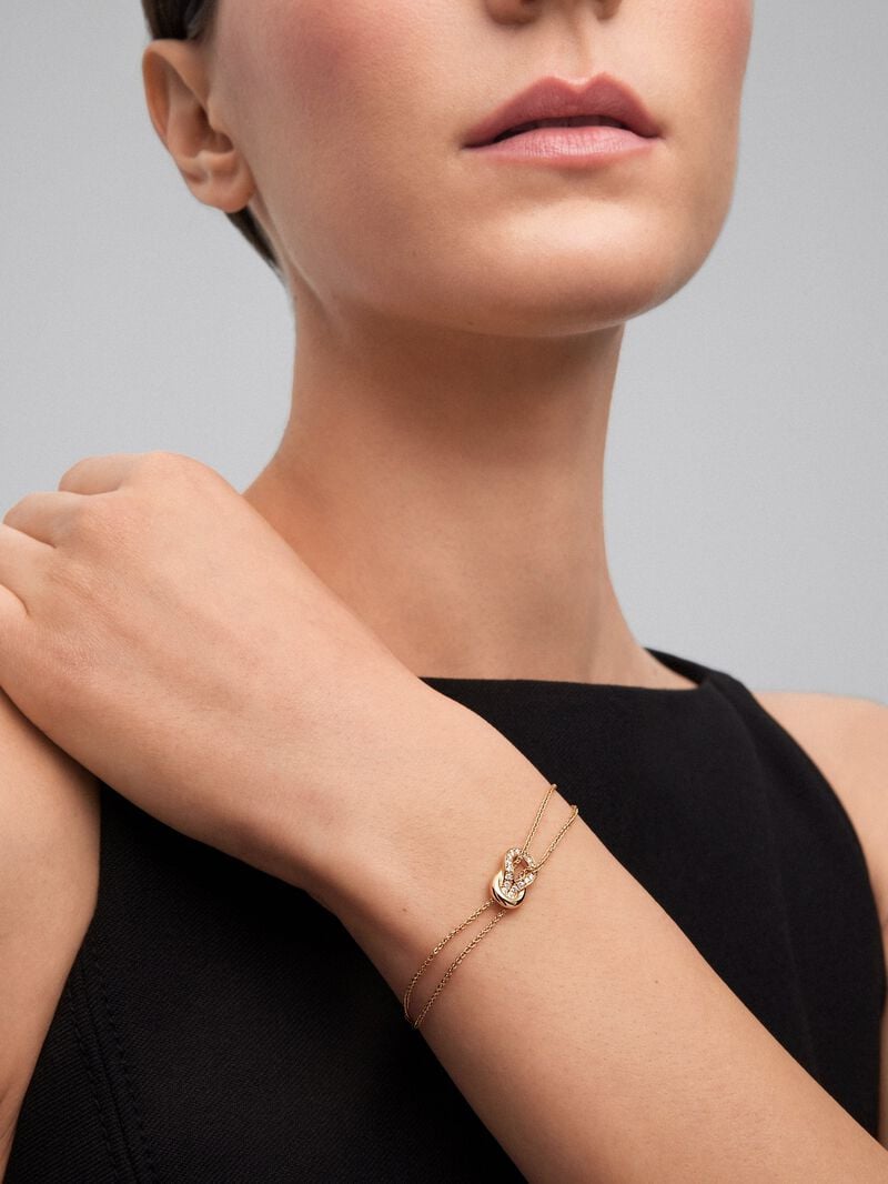 18K yellow gold bracelet with 17 brilliant-cut diamonds with a total of 0.15 cts and a knot shape image number 2