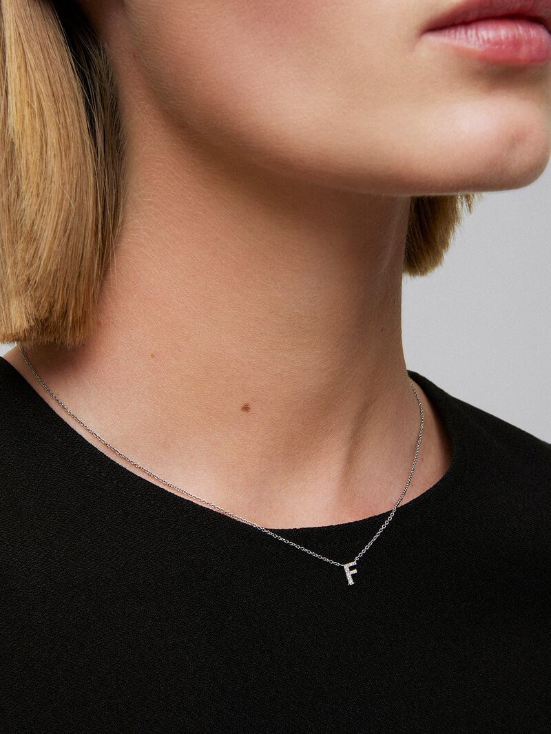 Pendant necklace with small initial in 18K white gold and diamonds. image number 1