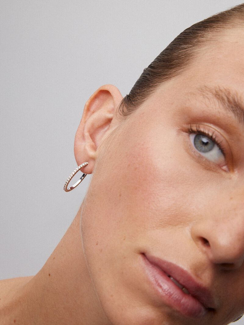 Thin hoop earrings made of 18K white gold with diamonds. image number 4