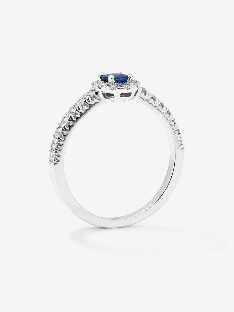 18K white gold ring with brilliant-cut blue sapphire of 0.4 cts and border and arm of 24 brilliant-cut diamonds with a total of 0.3 cts image number 2