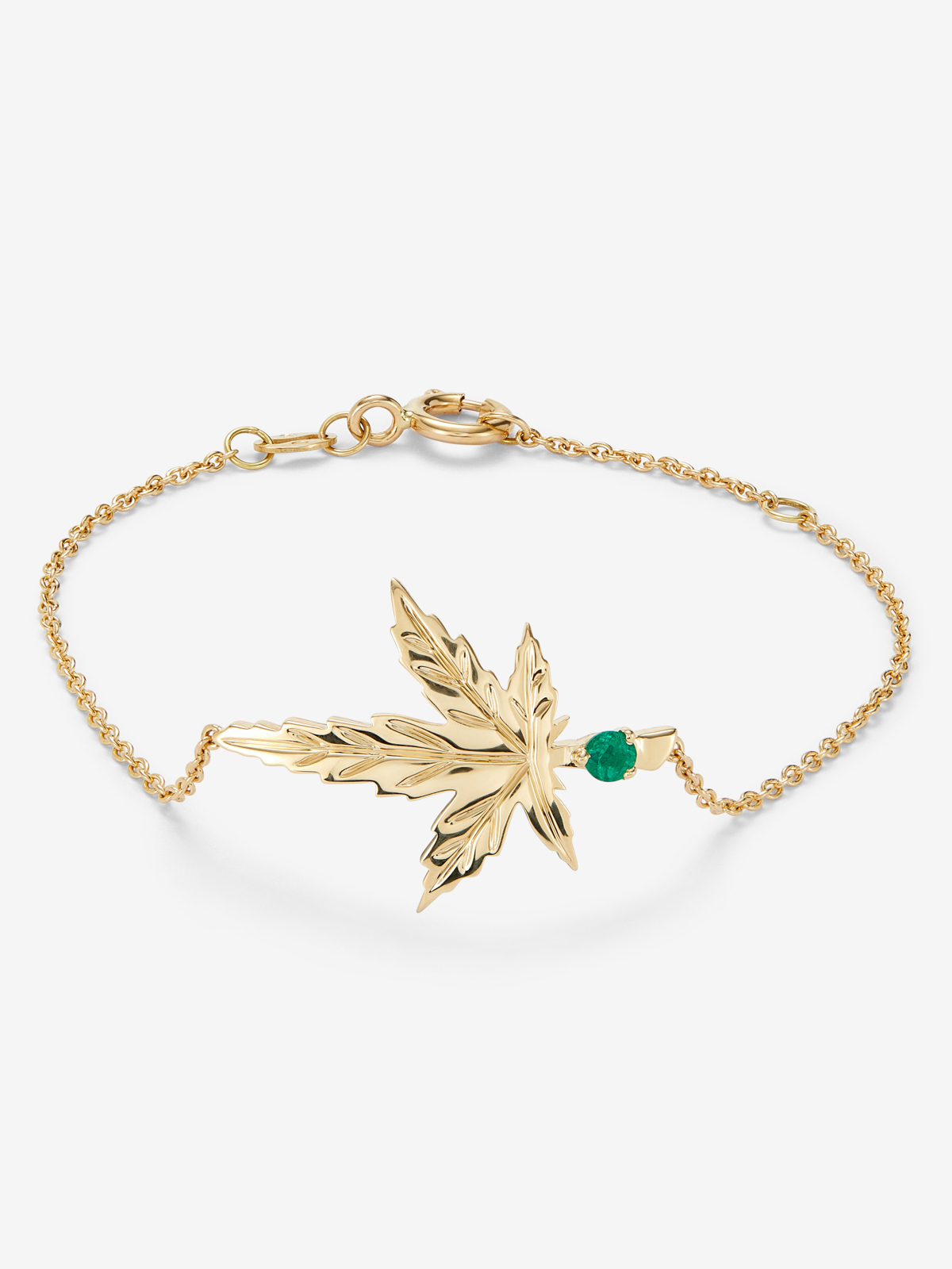 18K yellow gold bracelet with a 0.11 ct brilliant-cut emerald, in a maple leaf design.