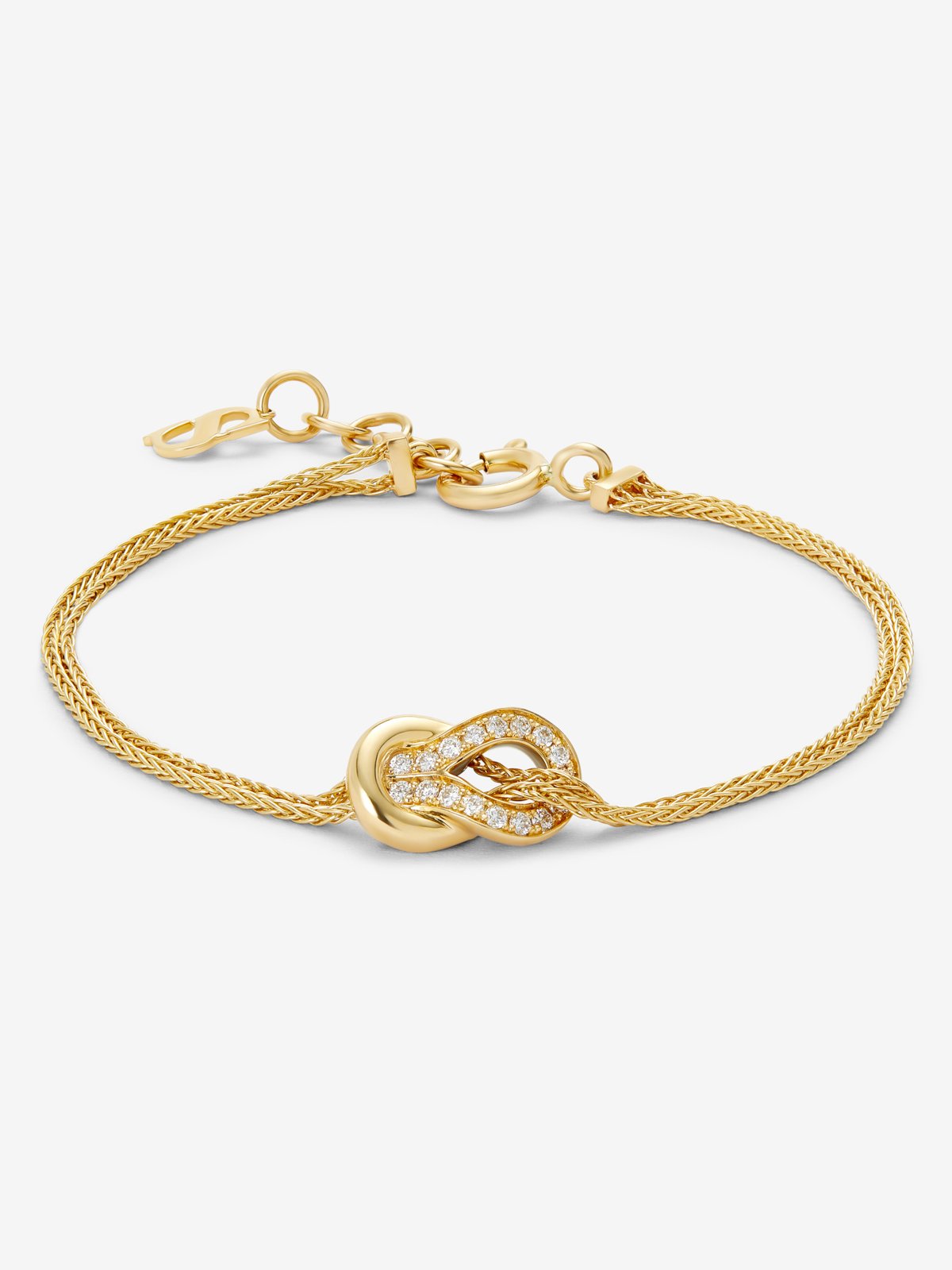 Pulsera de oro amarillo de 18K con 17 diamantes en talla brillante con un total de 0,15 cts y forma de nudo