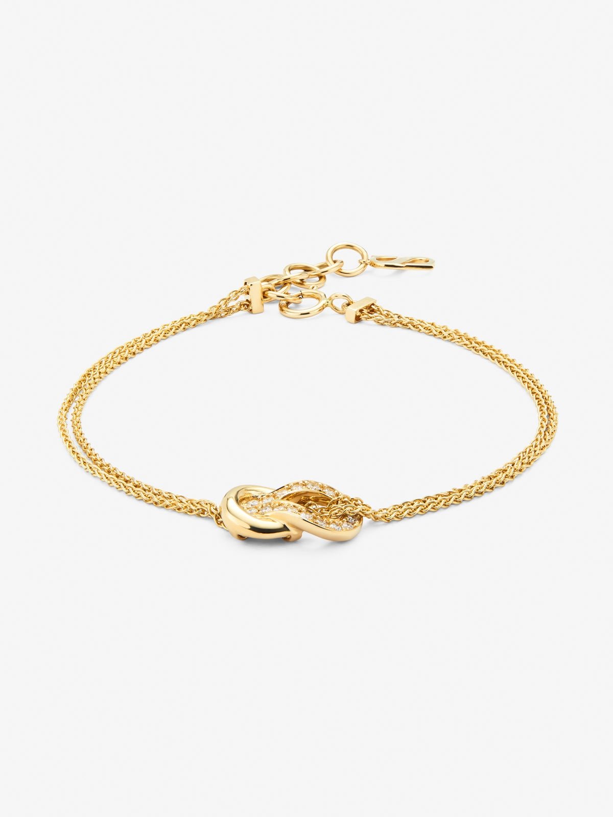 18K yellow gold bracelet with 17 brilliant-cut diamonds with a total of 0.15 cts and a knot shape