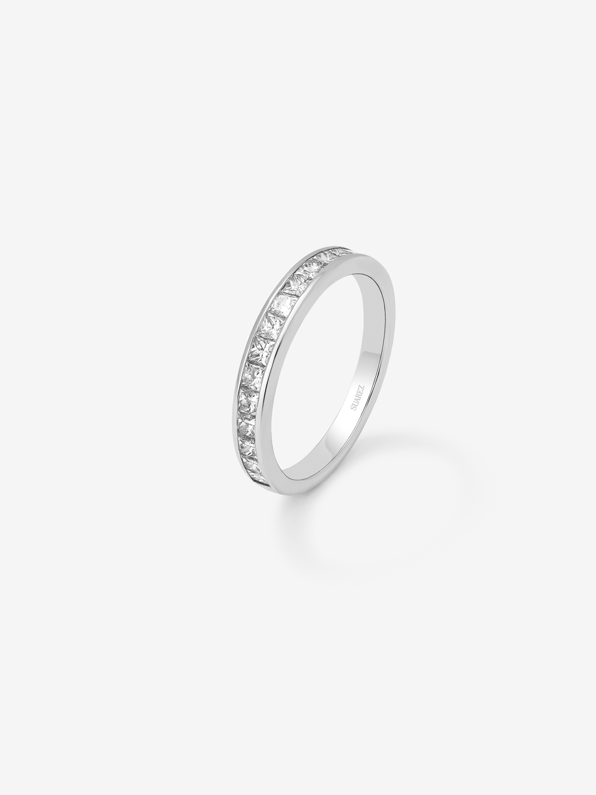 Half eternity engagement ring in 18K white gold with princess cut diamonds on a 0.70ct rail.
