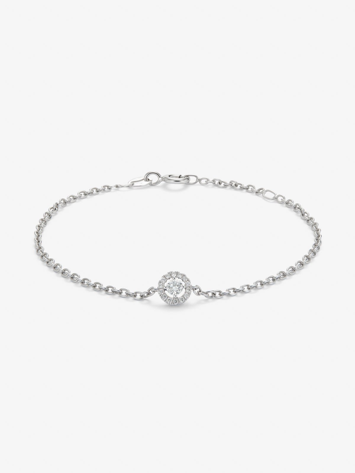 Pulsera cadena de oro blanco de 18K con diamante solitario y orla de diamantes