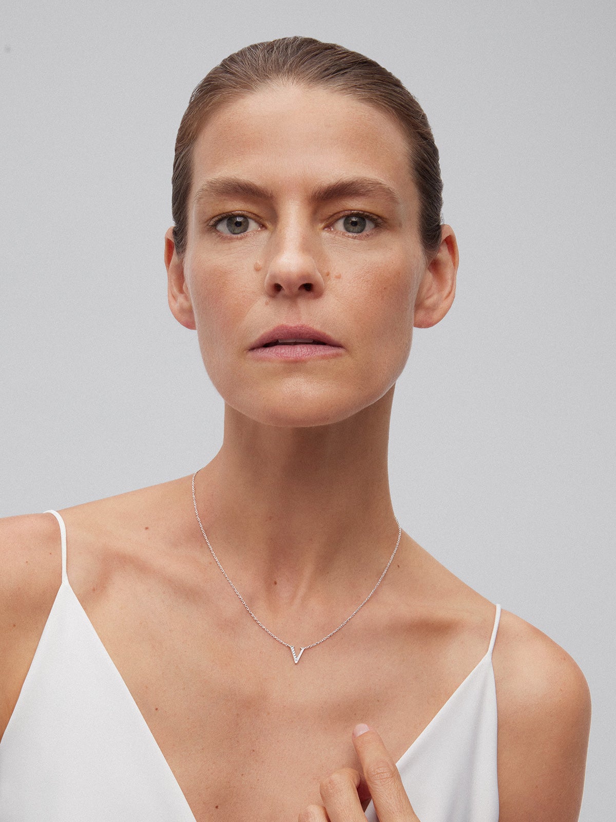 Pendant necklace with 18K white gold initial and diamonds