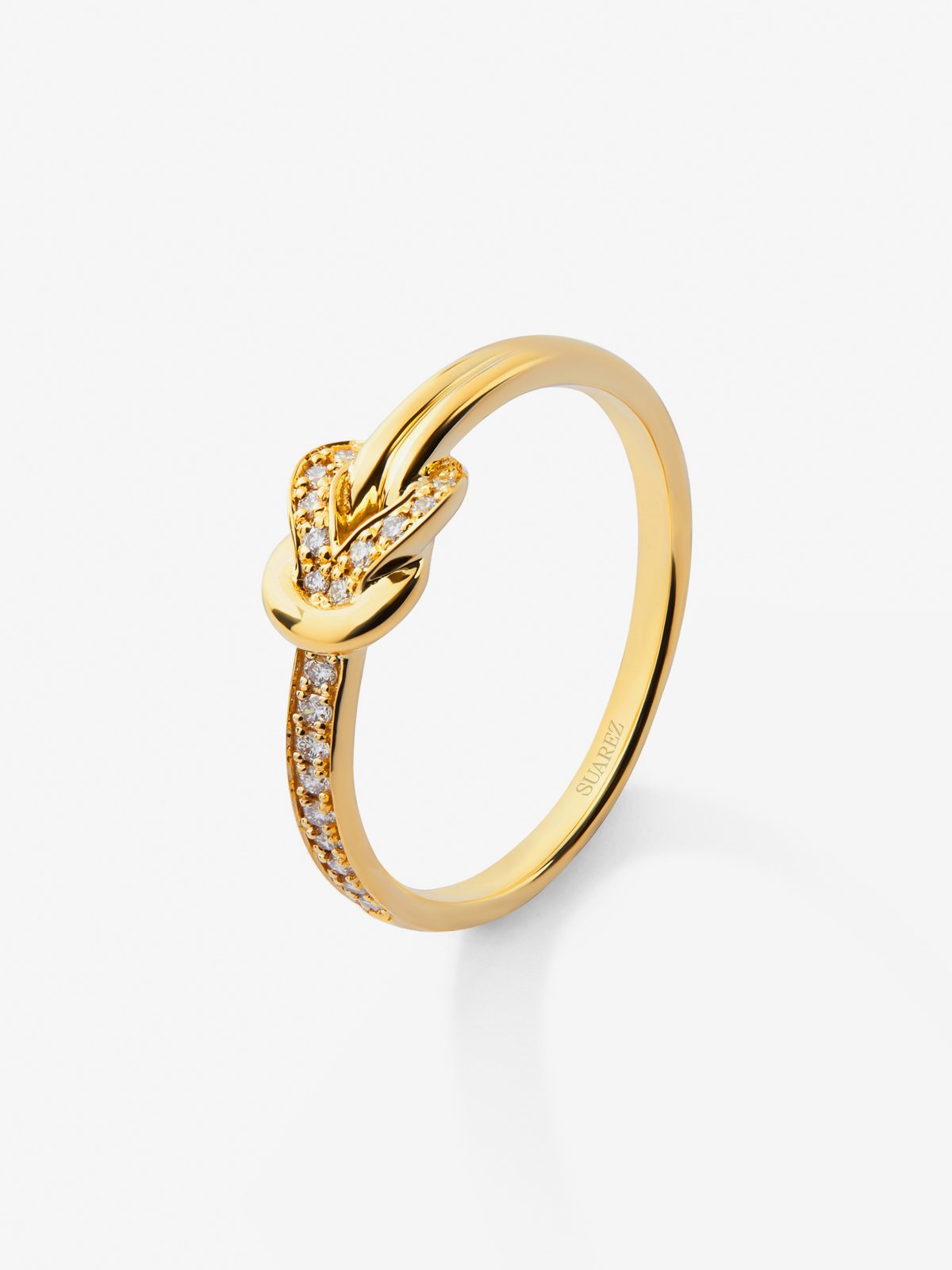 18K yellow gold ring with 15 brilliant-cut diamonds with a total of 0.09 cts and a knot shape