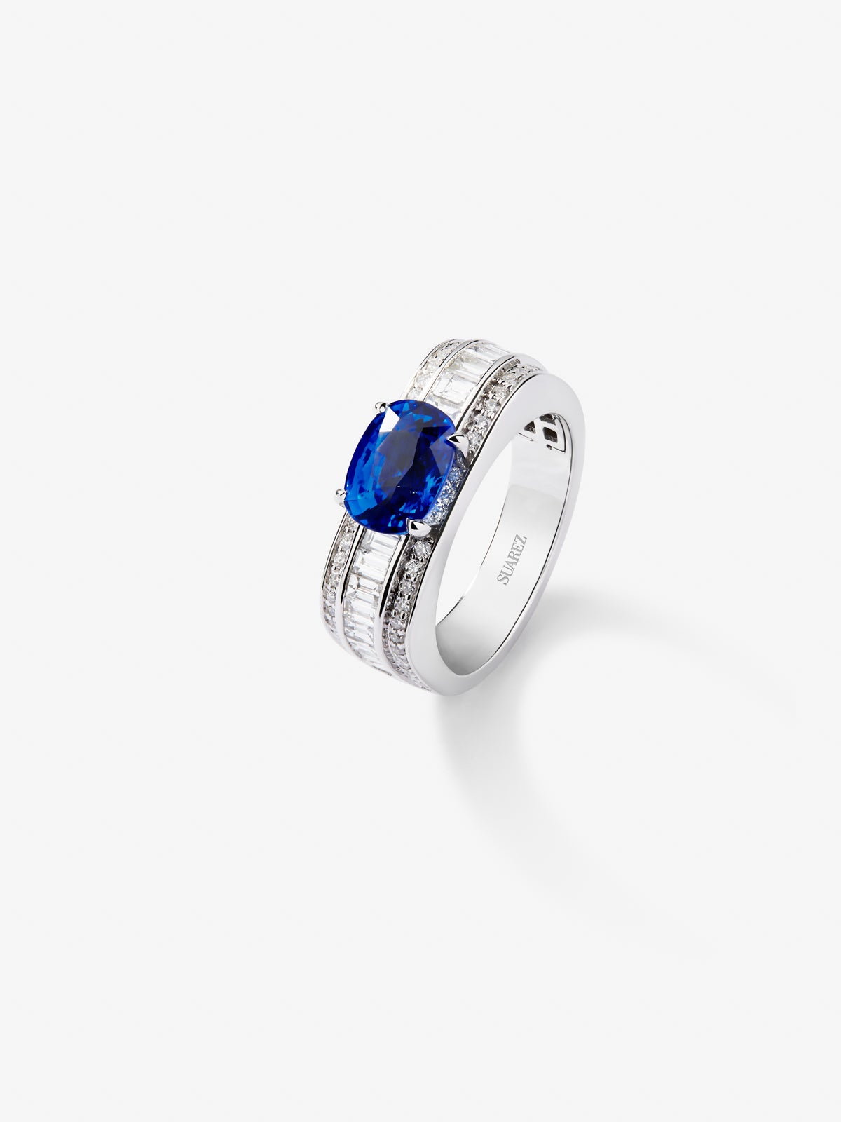 18K white gold ring with royal blue sapphire in cushion cut of 2.51 cts and 72 diamonds in baguette and brilliant cut with a total of 0.71 cts