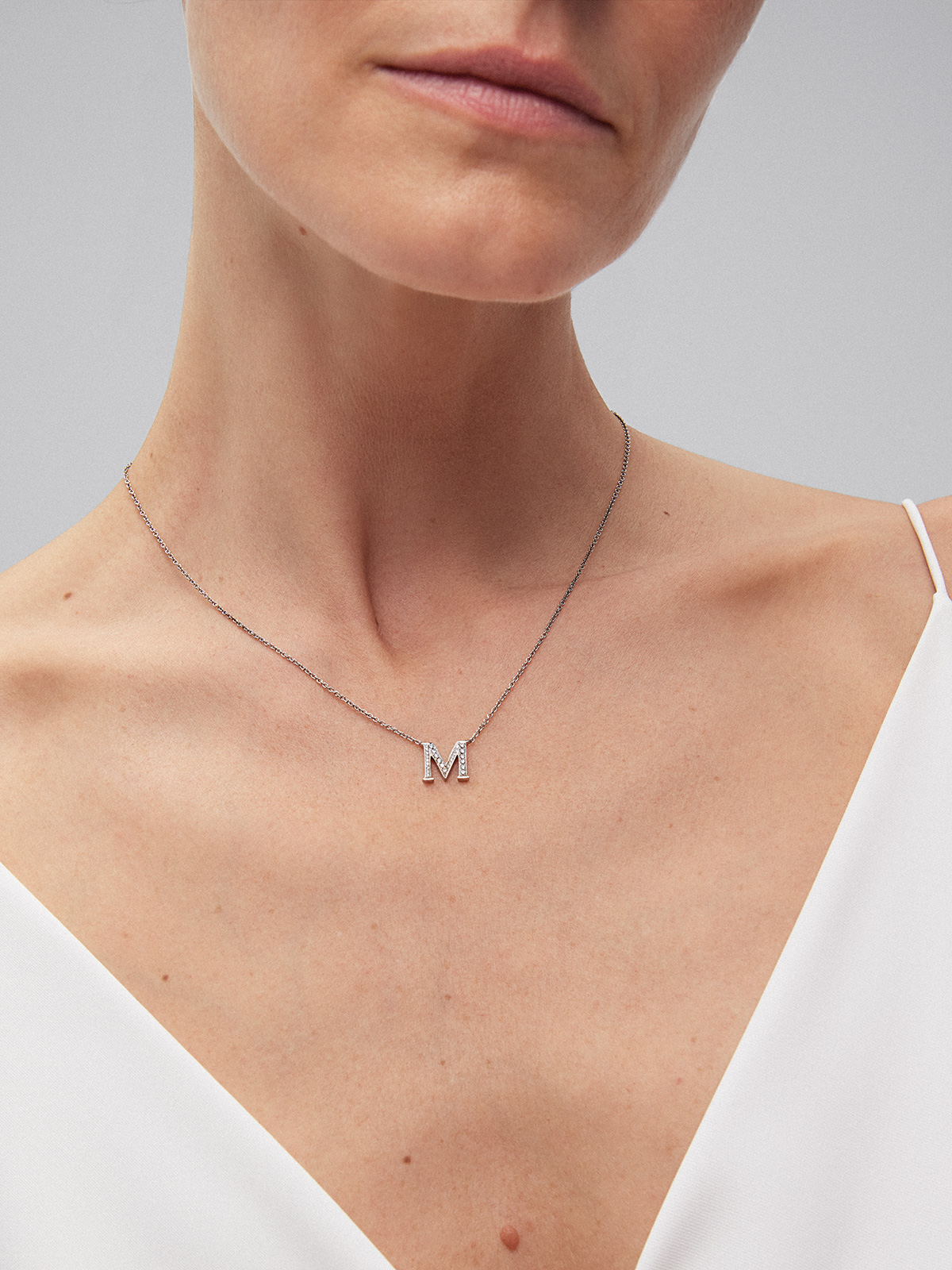 Pendant necklace with 18K white gold initial and diamonds