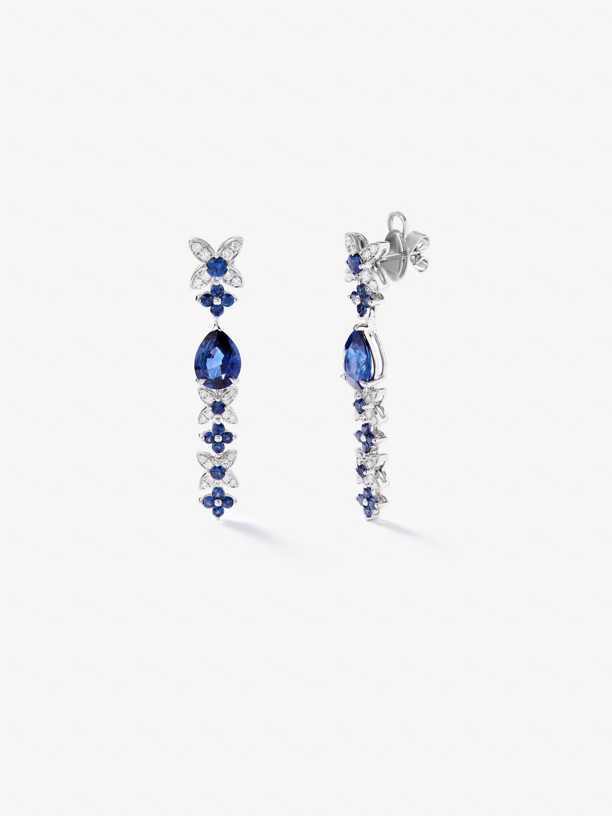 18k white gold earrings with royal blue sapps in pear size 4.05 cts, blue sapphires in bright size 1.27 cts and white diamonds in a bright size of 0.5 cts