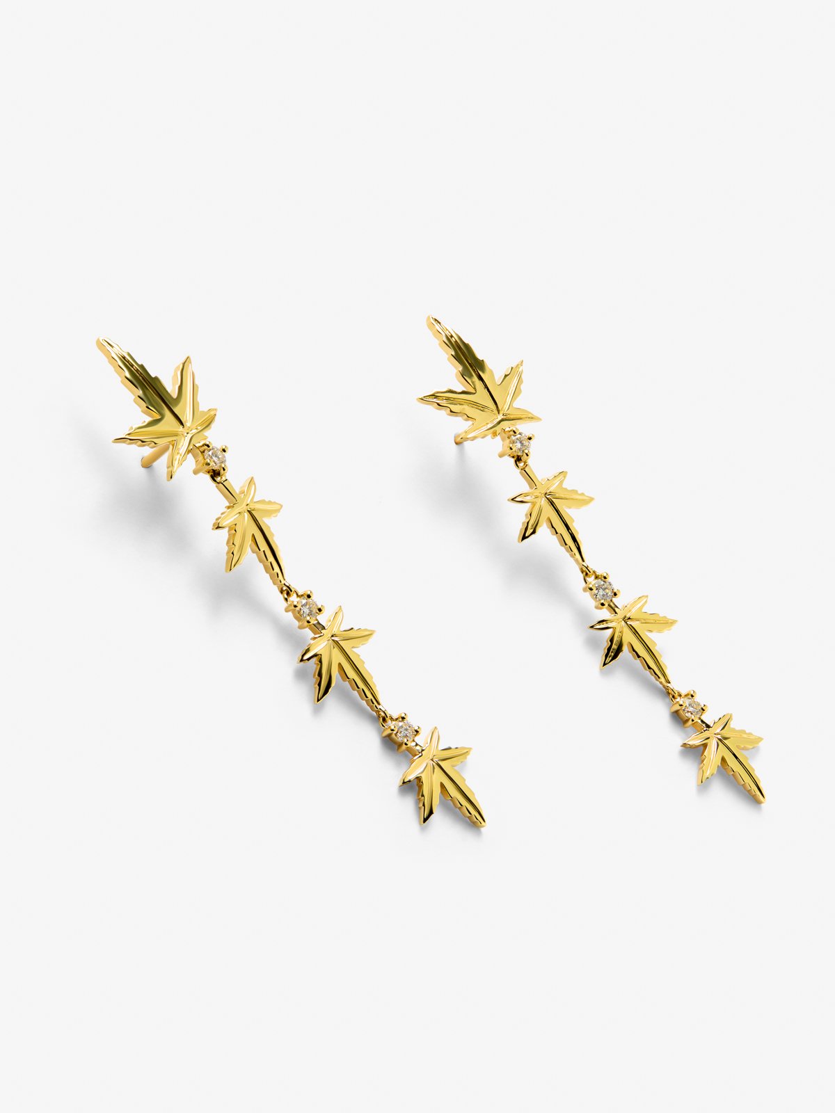 18K yellow gold earrings with six brilliant-cut diamonds totaling 0.29 cts, in a maple leaf design