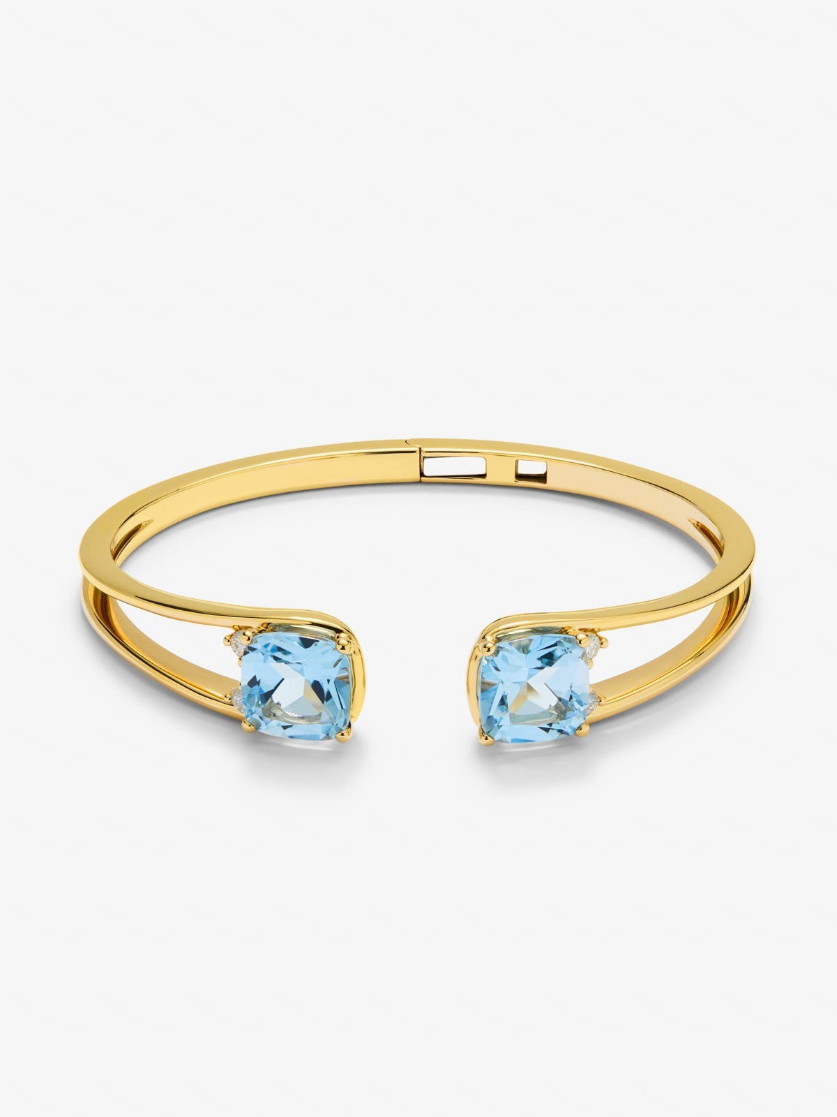 Rigid 18K yellow gold bracelet with 2 sky blue topazes in cushion cut with a total of 0.12 cts