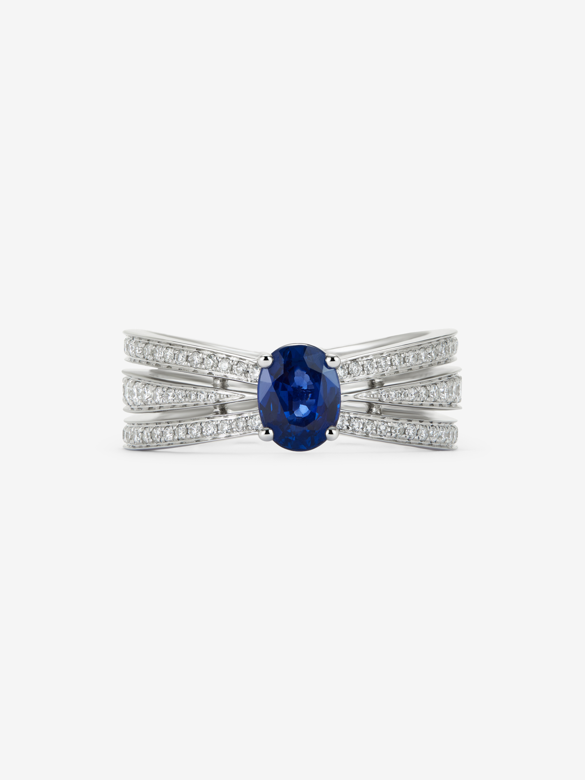 Anillo multibrazo de oro blanco de 18K con zafiro azul en talla oval de 0,81 cts y diamantes en talla brillante con un total de 0,45 cts