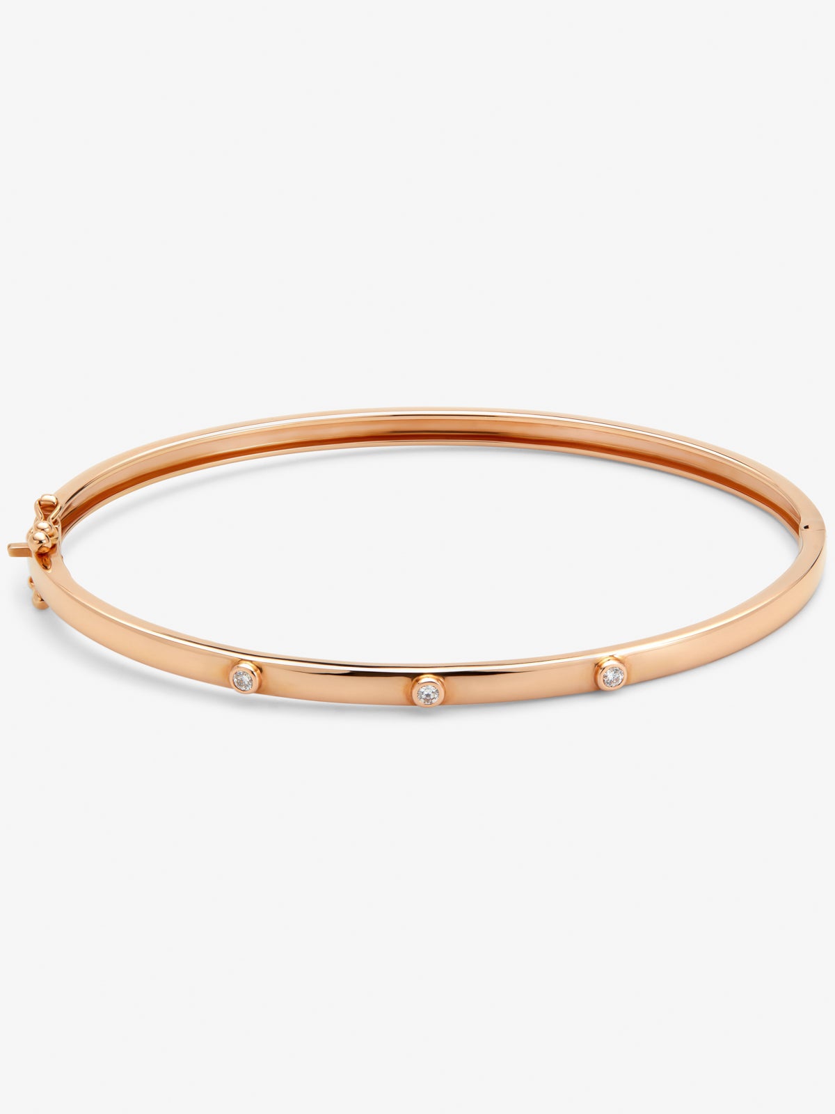 Thin rigid bracelet in 18K rose gold with diamonds.