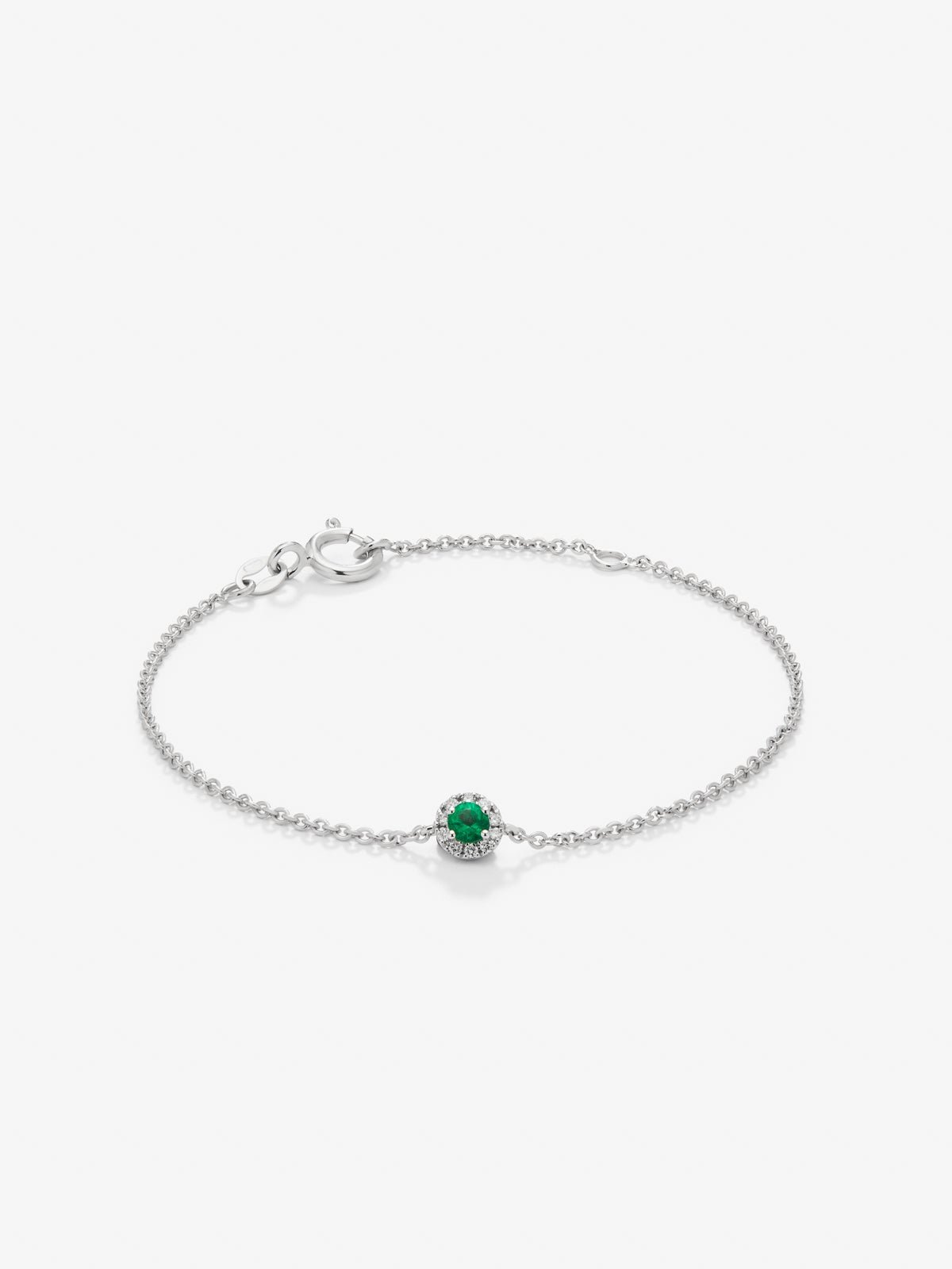Pulsera de oro blanco de 18K con esmeralda en talla brillante de 0,1 cts y diamantes en talla brillante de 0,05 cts