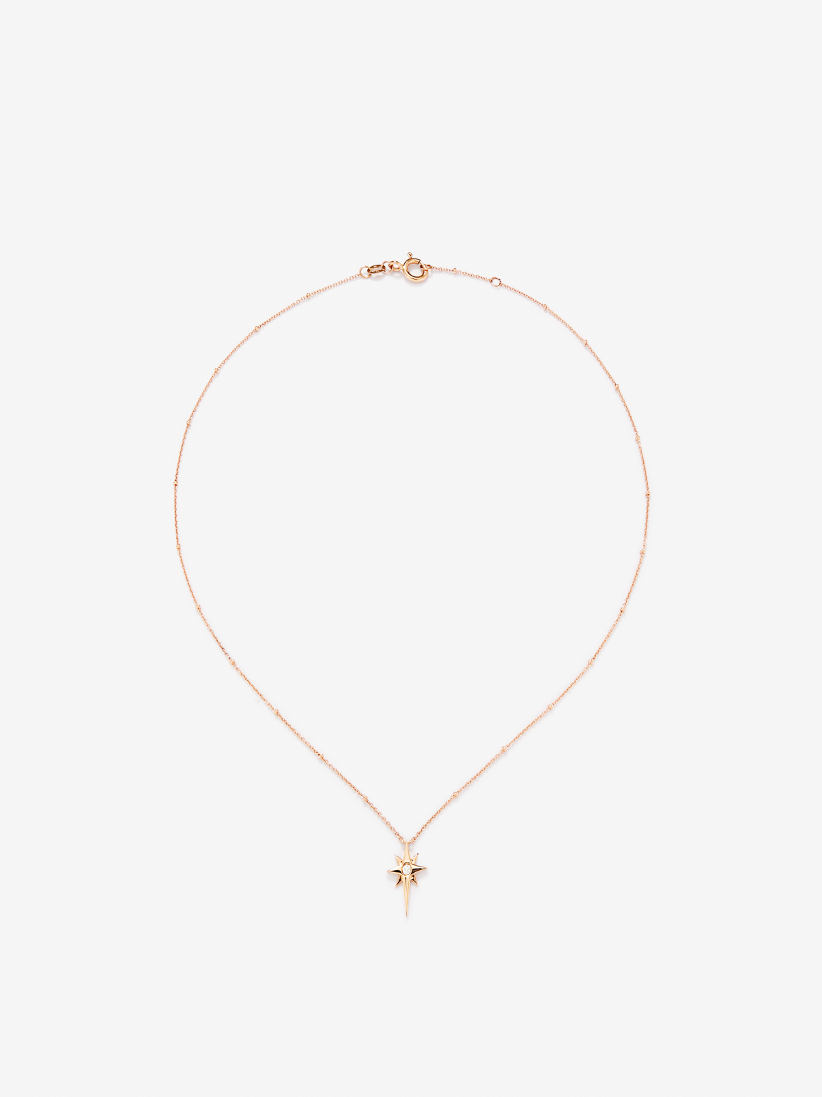 Pendant chain with 18K rose gold star with diamond.
