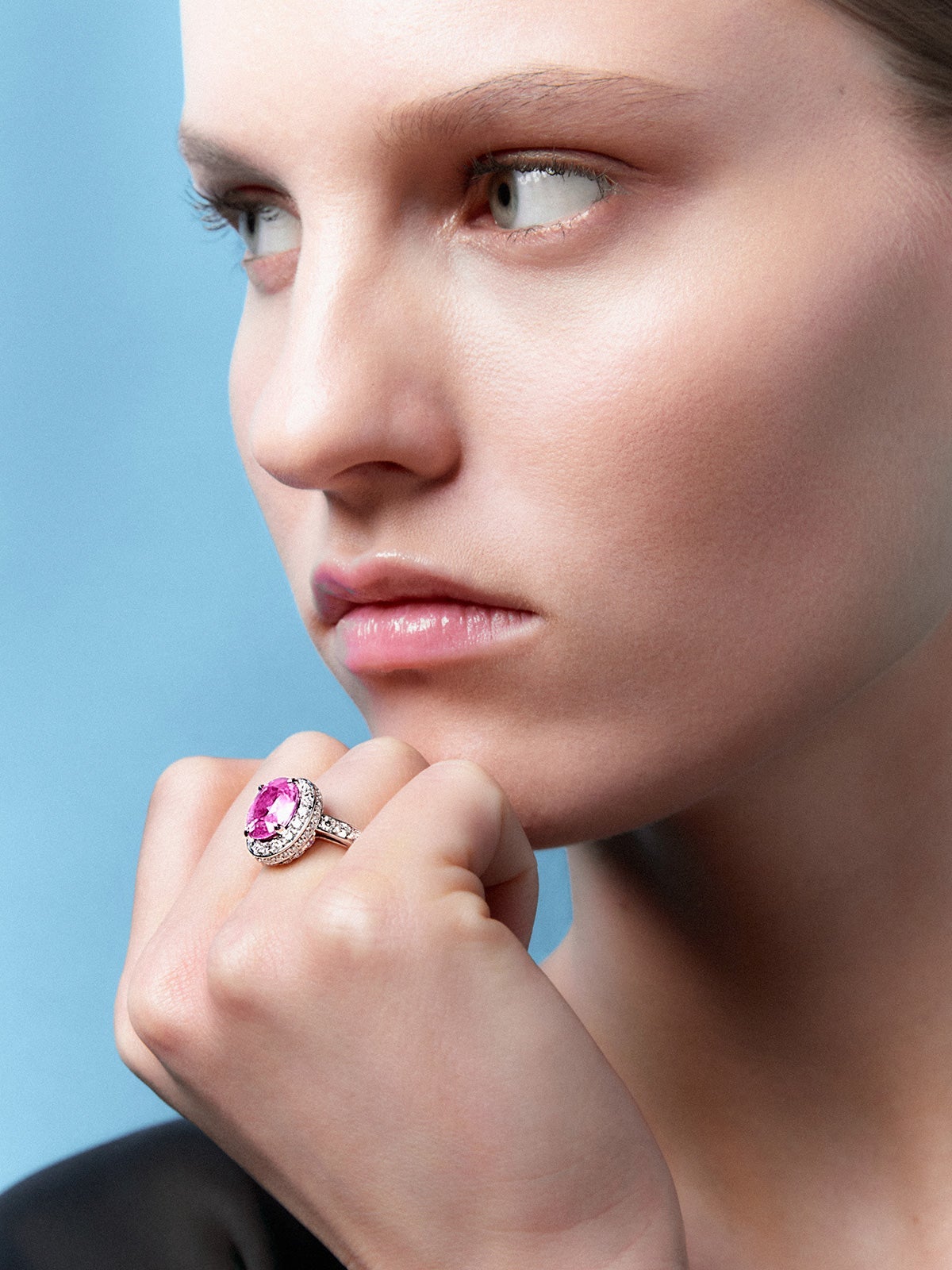 18kt white gold ring with 4.49 carat oval cut pink sapphire and diamonds.