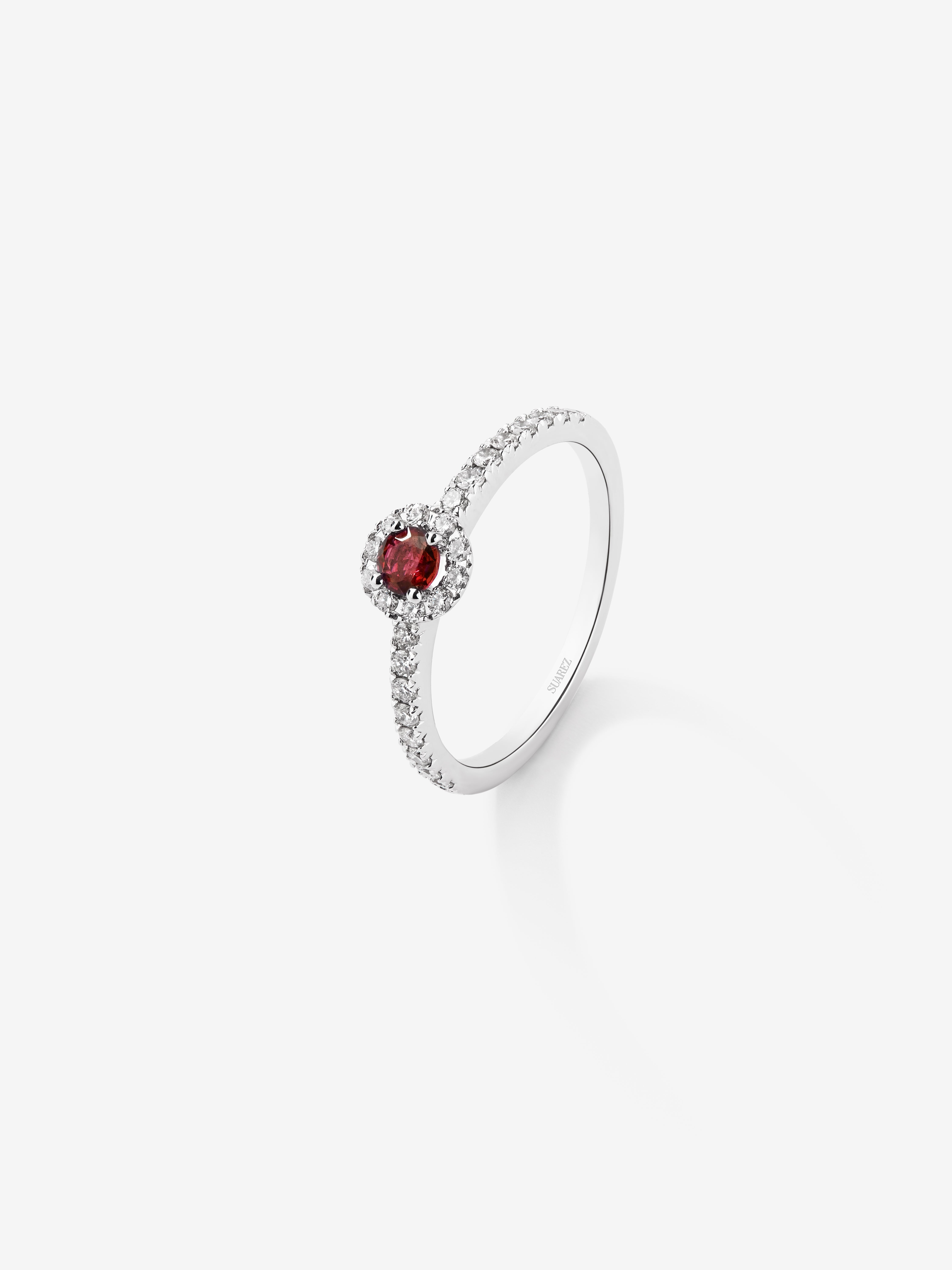 18K white gold halo ring with ruby and diamond.