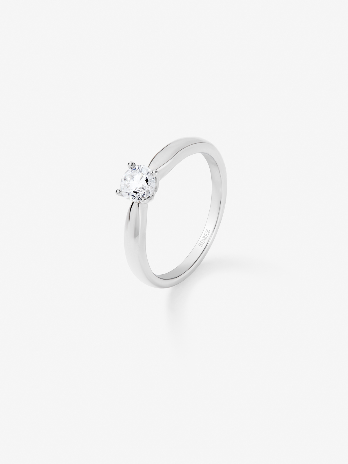 18K white gold solitaire engagement ring with diamond.
