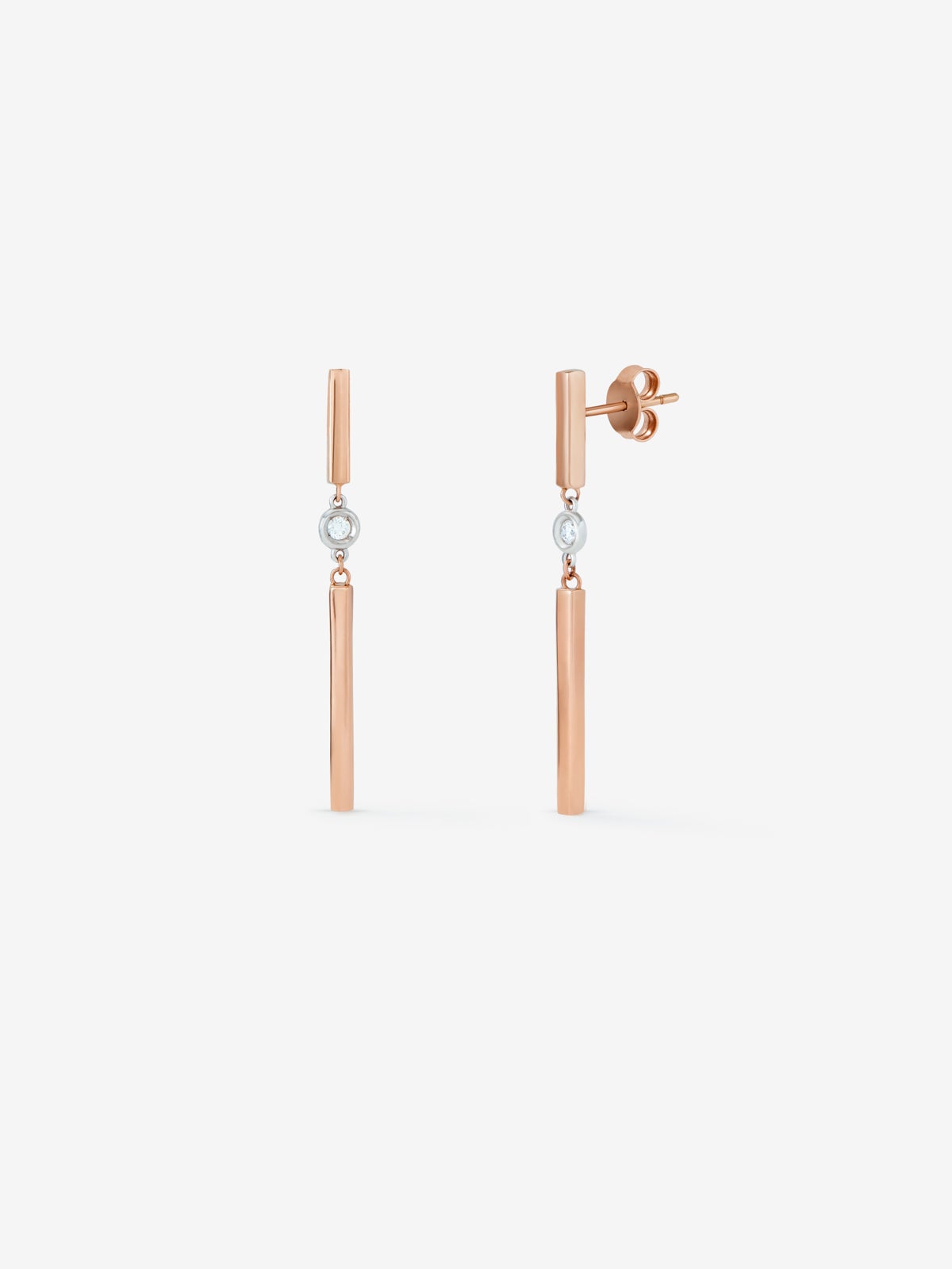 Long earrings made of 18K rose gold bars with diamonds.