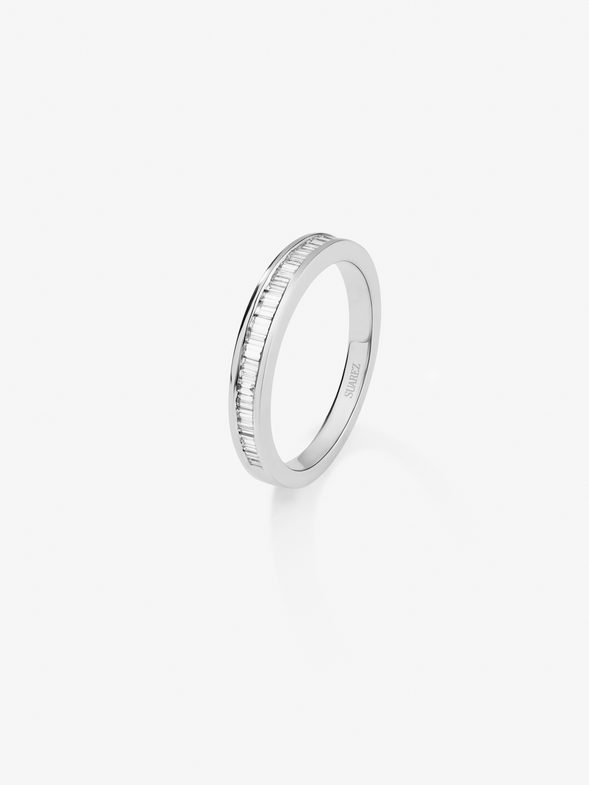 Half engagement ring band made from 18K white gold with baguette cut diamonds set in band.
