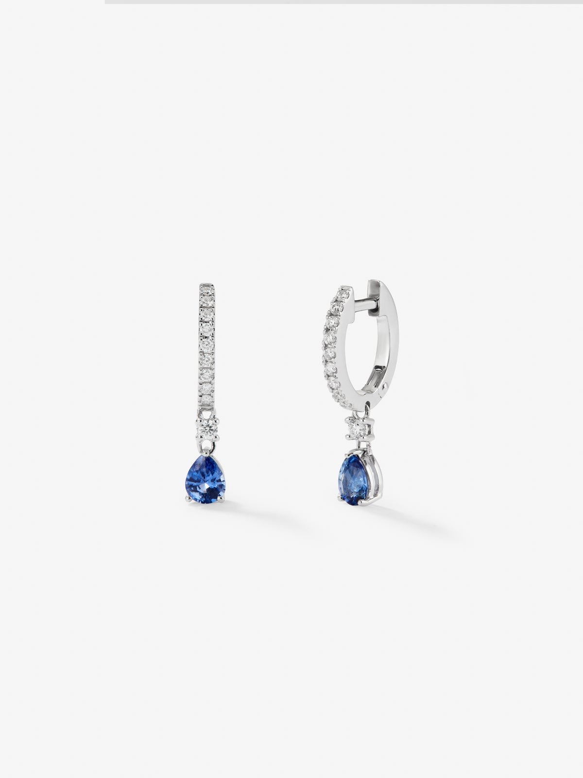 18K white gold hoop earrings with 2 pear-cut blue sapphires with a total of 0.77 cts and 28 brilliant-cut diamonds with a total of 0.3 cts