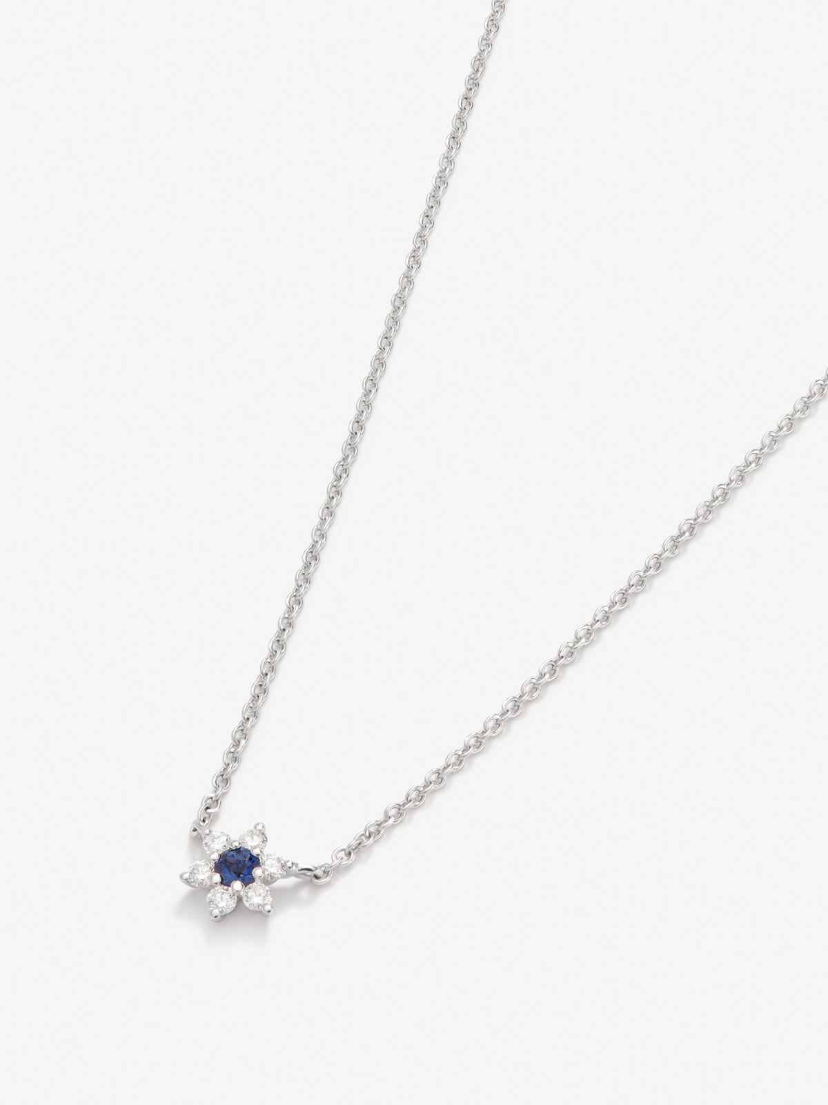 18K white gold pendant with 0.1 ct brilliant-cut blue sapphire and 0.12 ct brilliant-cut star-shaped diamonds