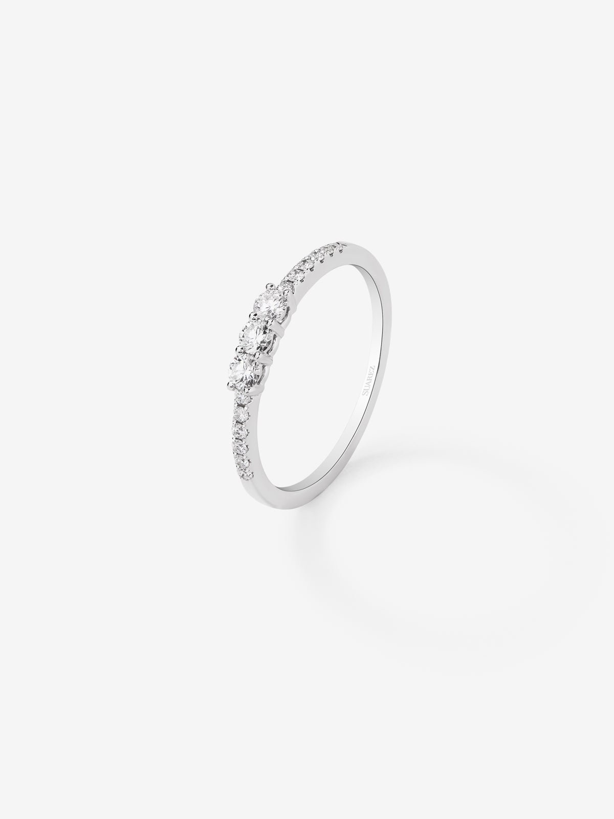 18K white gold triple ring with 3 central brilliant-cut diamonds with a total of 0.19 cts and an arm of 12 brilliant-cut diamonds with a total of 0.09 cts