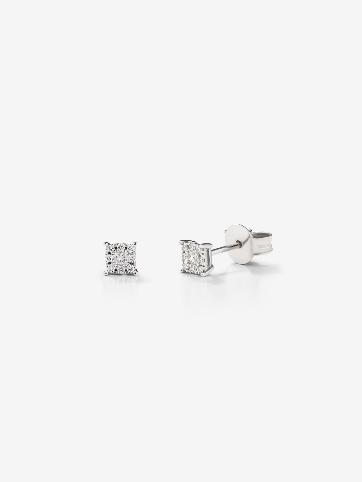 18K white gold earrings with pavé diamonds.