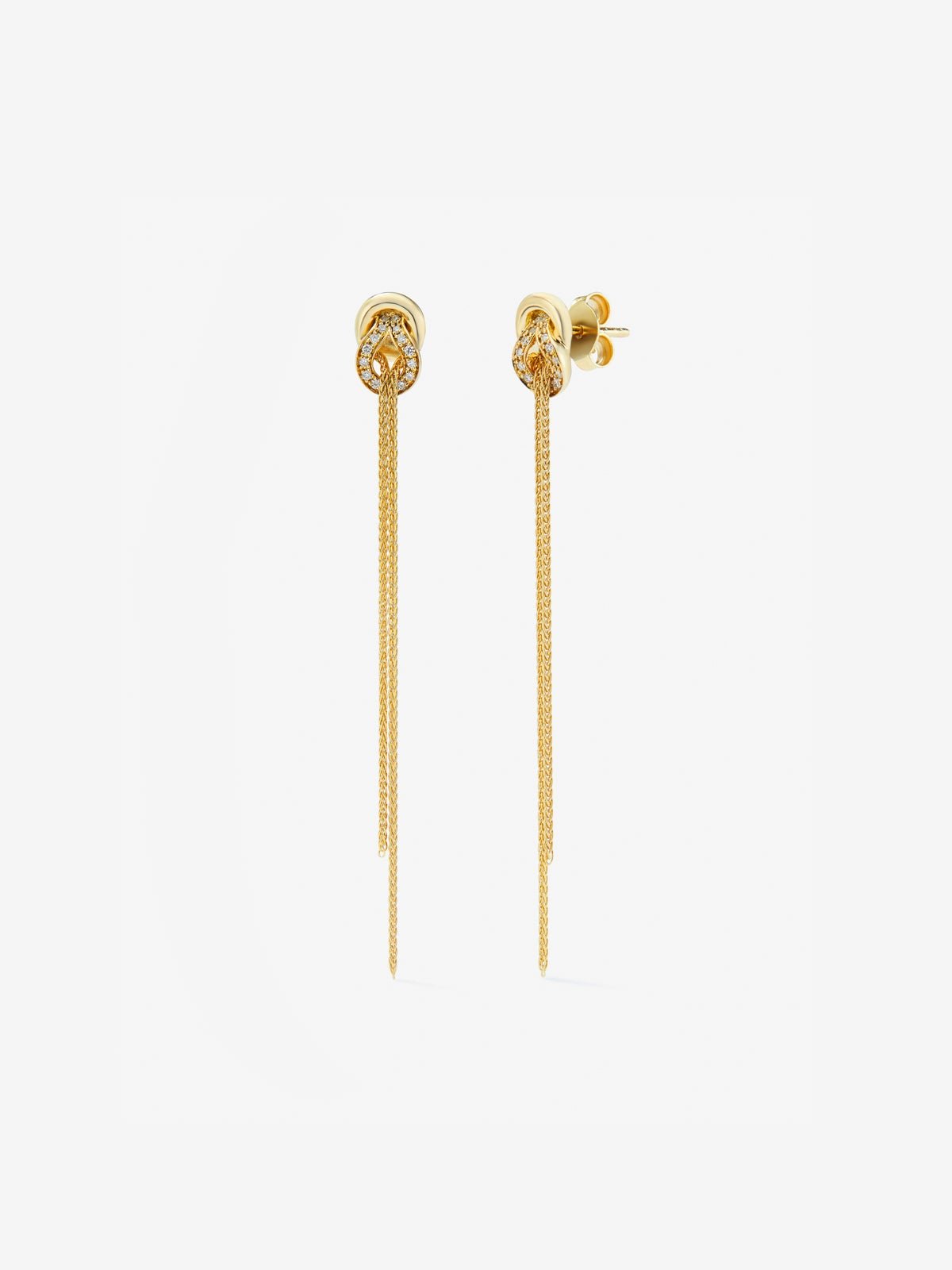 Pendientes largos de oro amarillo de 18K con diamantes blancos en talla brillante de 0,5 cts y forma de nudo