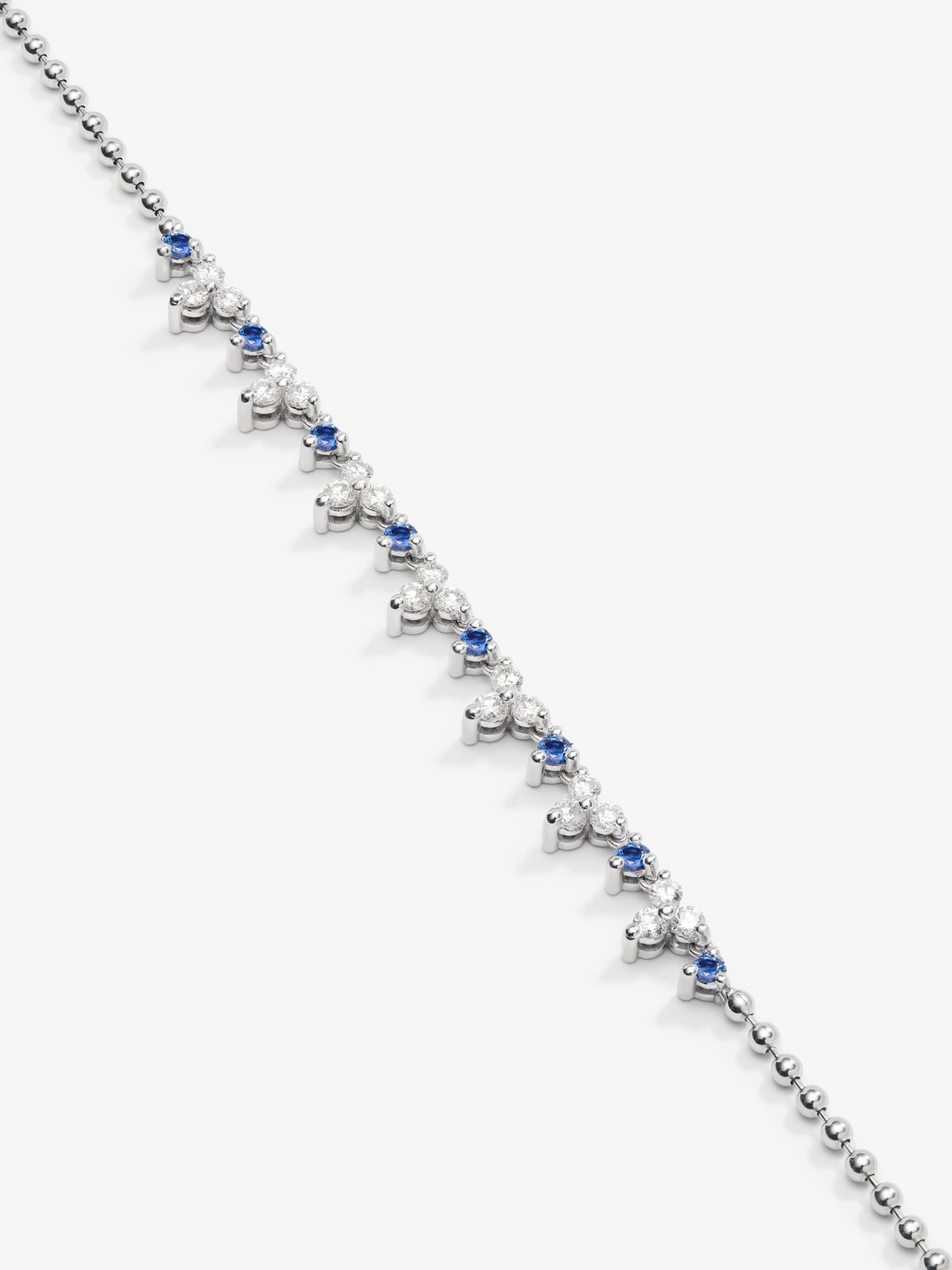 18K white gold pendant with 8 brilliant-cut blue sapphires with a total of 1.35 cts and 21 brilliant-cut diamonds with a total of 1.25 cts